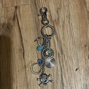 Skull, shapes, and blue stone dangle bag tag